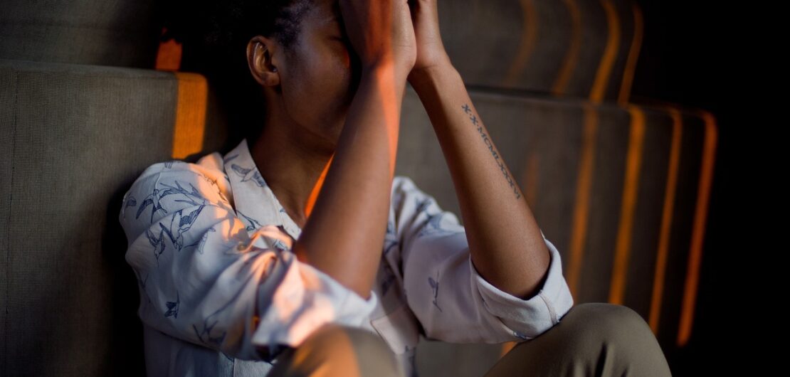 sad person head in hands