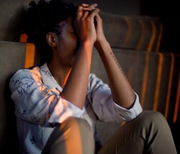 sad person head in hands