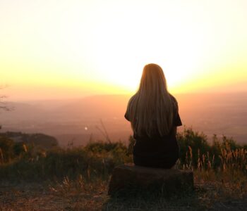woman looking at sunset