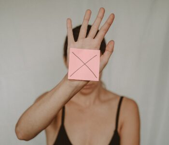 woman showing paper with prohibition sign